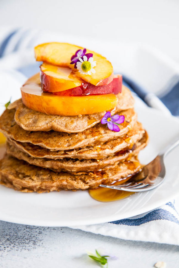 Stack of pancakes on a white plate